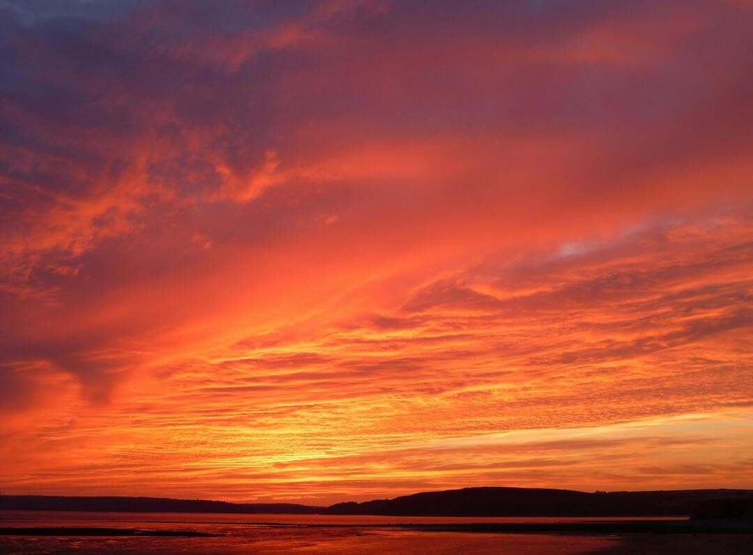 Mountains Under Red Skies Image.