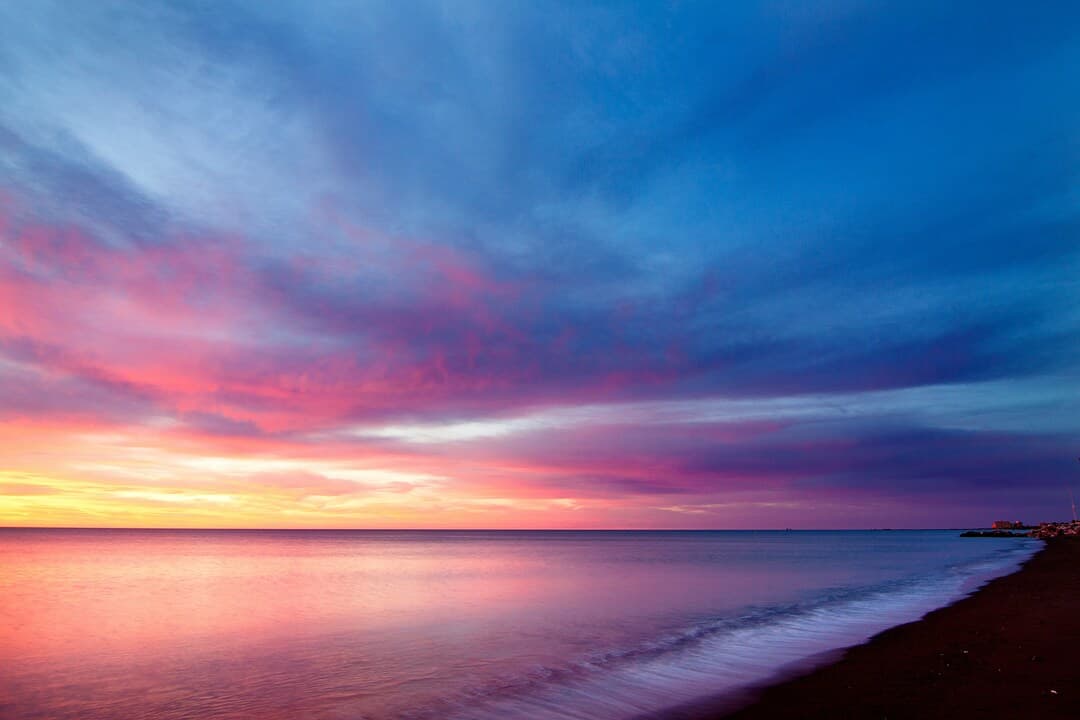 Playa De Huelin, Málaga in Spain Sunset Image.