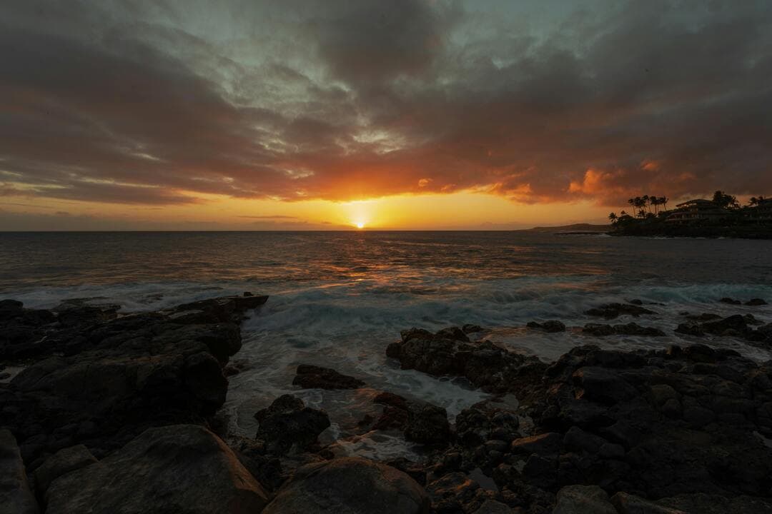 Sunset Above Sea and Coastline Image.